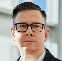 Alexander Hughes, generální ředitel a vedoucí pracovník firmy zaměřené na obchodování s kryptoměnami, portrét